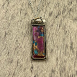 Purple Dahlia Kingman Turquoise Hanging Bar necklace with a cowboy hat