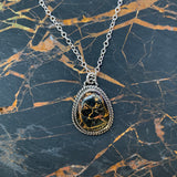 Cute little Iron Buffalo oval necklace