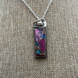 Purple Dahlia Kingman Turquoise Hanging Bar necklace with a cowboy hat