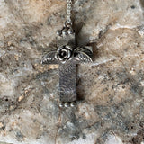 Sterling Silver flower and leaves cross necklace.
