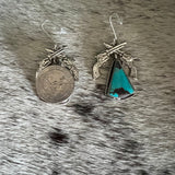 Crossed pistols and turquoise earring