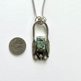 Turquoise, feathers with a longhorn steer necklace