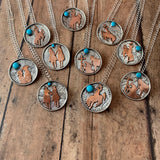 1 1/8 Round Sterling silver with Bronc rider cross copper cutout