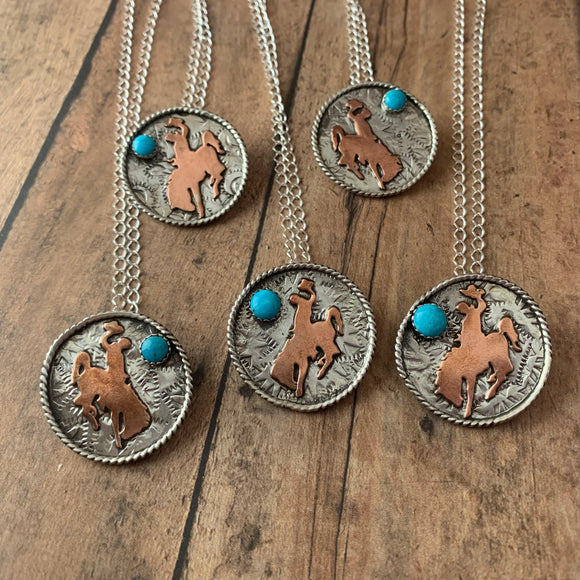 1 1/8 Round Sterling silver with Bronc rider cross copper cutout